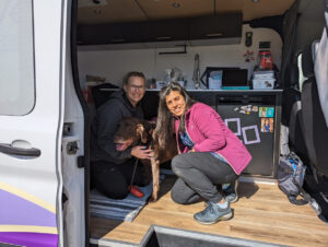 Dr. Mahmood and Stacey with dog in van